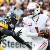 Dec 3, 2023; Pittsburgh, Pennsylvania, USA; Arizona Cardinals quarterback Kyler Murray (1) escapes the pass rush of Pittsburgh Steelers linebacker Elandon Roberts (50) during the first quarter at Acrisure Stadium.