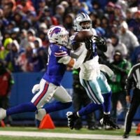 Buffalo Bills cornerback Taron Johnson (7) breaks up a pass intended for Dallas Cowboys wide receiver CeeDee Lamb (88).