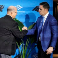 Feb 1, 2024; Charlotte, NC, USA; Carolina Panthers team owner David Tepper greets Dan Morgan during the introductory press conference for new general manager Dan Morgan and head coach Dave Canales at Bank of America Stadium.