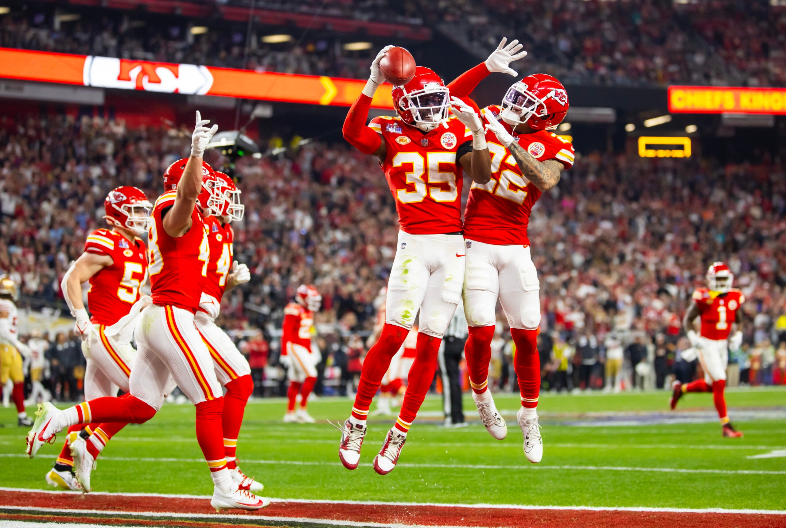 Feb 11, 2024; Paradise, Nevada, USA; Kansas City Chiefs cornerback Jaylen Watson (35) celebrates with Trent McDuffie (22) after recovering a muffed punt against the San Francisco 49ers in the second half in Super Bowl LVIII at Allegiant Stadium.