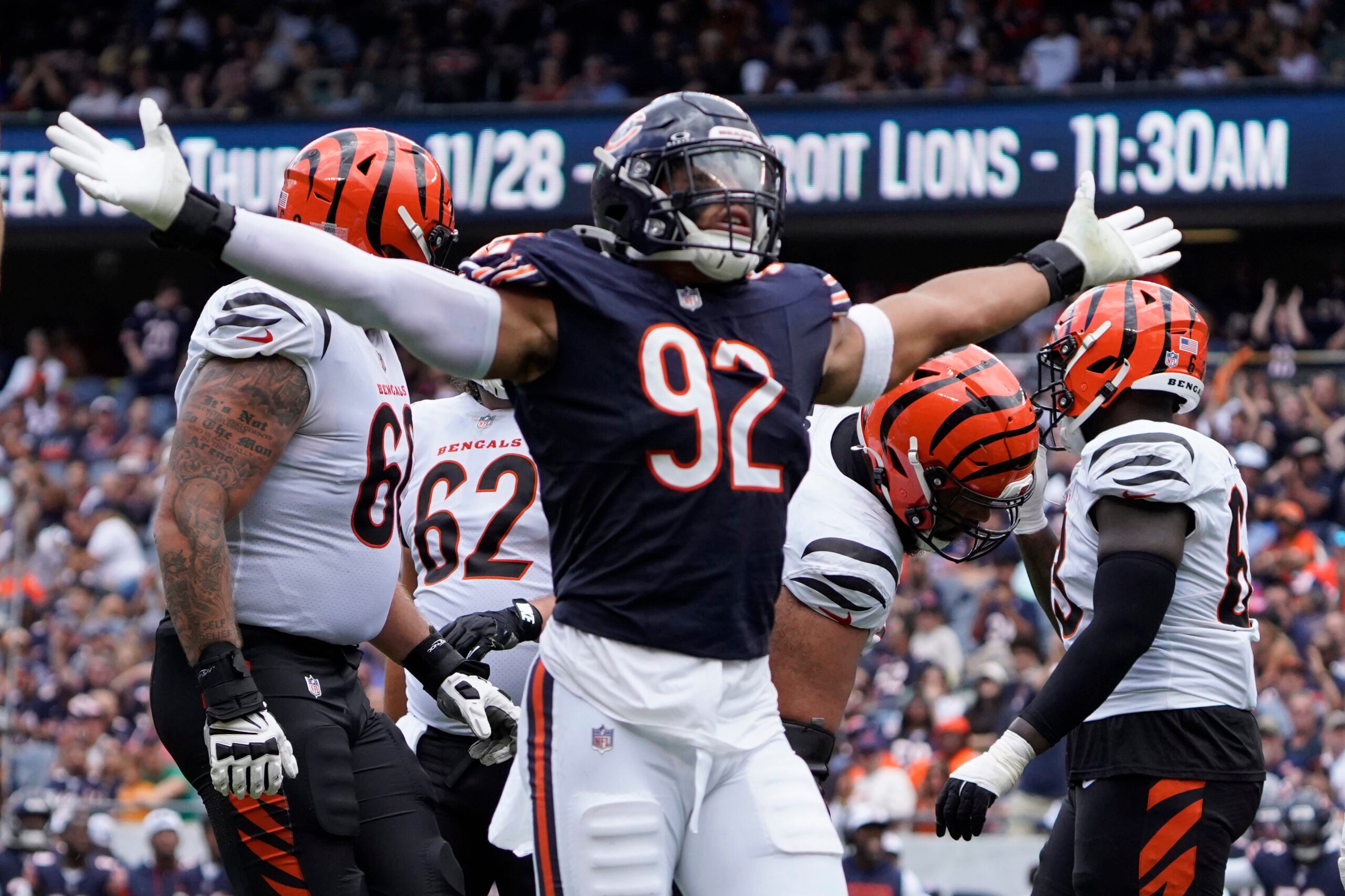 Aug 17, 2024; Chicago, Illinois, USA; Chicago Bears defensive end Daniel Hardy (92) celebrates his sack of Cincinnati Bengals quarterback Logan Woodside (11) during the second half at Soldier Field.