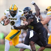 Aug 29, 2024; Boulder, Colorado, USA; Colorado Buffaloes linebacker LaVonta Bentley (20) tackles North Dakota State Bison quarterback Cole Payton (9) in the first half at Folsom Field.