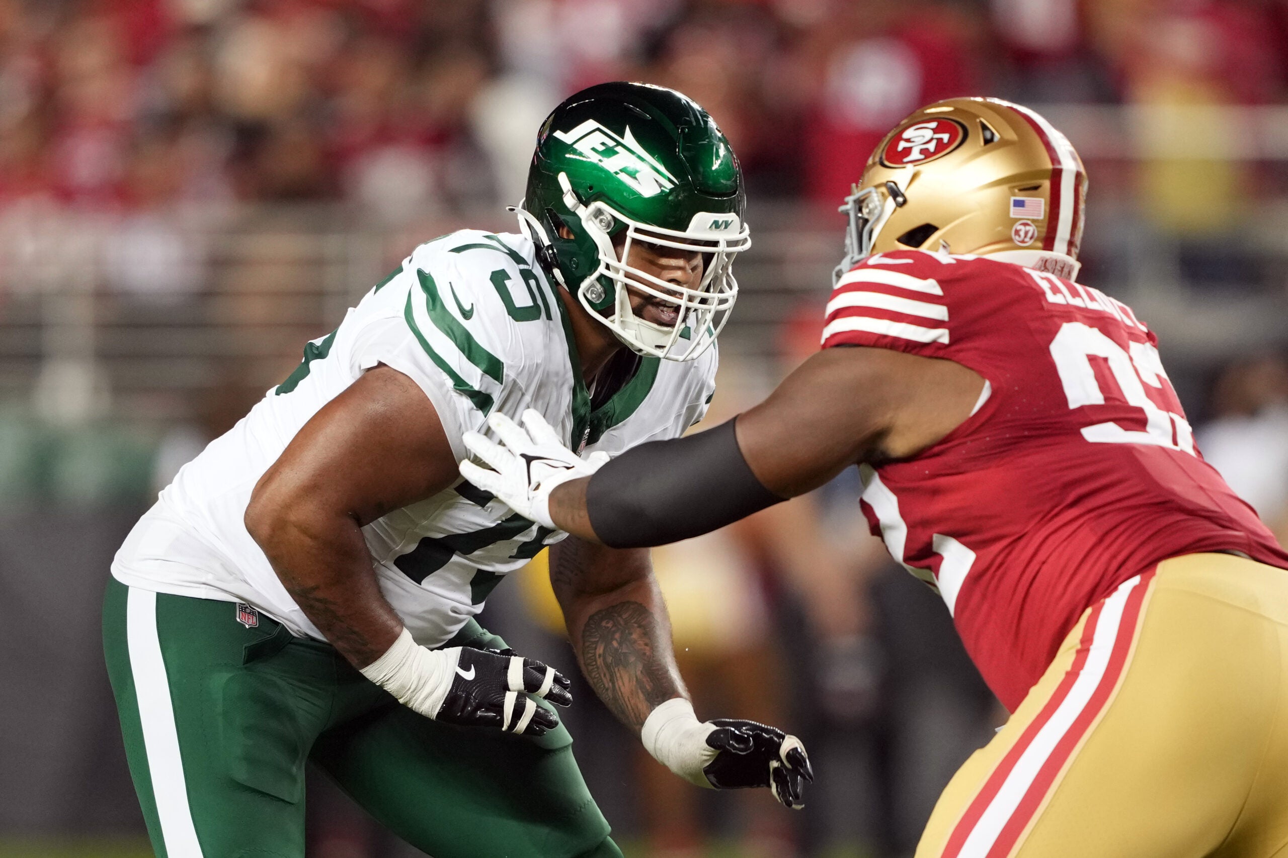 Sep 9, 2024; Santa Clara, California, USA; New York Jets guard Alijah Vera-Tucker (75) blocks against San Francisco 49ers defensive tackle Jordan Elliott (right) during the fourth quarter at Levi's Stadium.