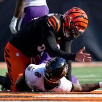 Cincinnati Bengals defensive end Trey Hendrickson (91) gestures to Baltimore Ravens quarterback Lamar Jackson (8) after tackling him in the fourth quarter of the NFL Week 5 game between the Cincinnati Bengals and Baltimore Ravens at Paycor Stadium in downtown Cincinnati on Sunday, Oct. 6, 2024. The Bengals fell to 1-4 on the season with a 41-38 loss to the Ravens.