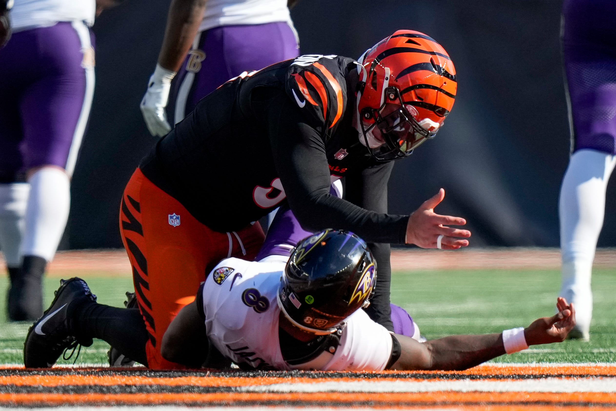 Cincinnati Bengals defensive end Trey Hendrickson (91) gestures to Baltimore Ravens quarterback Lamar Jackson (8) after tackling him in the fourth quarter of the NFL Week 5 game between the Cincinnati Bengals and Baltimore Ravens at Paycor Stadium in downtown Cincinnati on Sunday, Oct. 6, 2024. The Bengals fell to 1-4 on the season with a 41-38 loss to the Ravens.