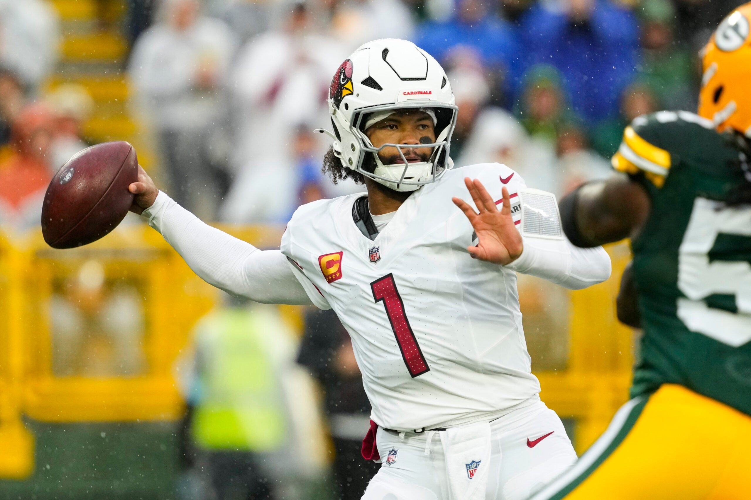 Oct 13, 2024; Green Bay, Wisconsin, USA; Arizona Cardinals quarterback Kyler Murray (1) throws a pass during the first quarter against the Green Bay Packers at Lambeau Field.