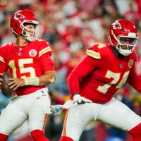 Oct 7, 2024; Kansas City, Missouri, USA; Kansas City Chiefs quarterback Patrick Mahomes (15) drops back to pass as offensive tackle Jawaan Taylor (74) gets ready to block during the first half against the New Orleans Saints at GEHA Field at Arrowhead Stadium. Mandatory Credit: Jay Biggerstaff-Imagn Images