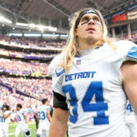 Oct 20, 2024; Minneapolis, Minnesota, USA; Detroit Lions linebacker Alex Anzalone (34) walks on the field after his teams win against the Minnesota Vikings at U.S. Bank Stadium.