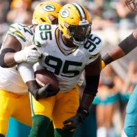 Oct 27, 2024; Jacksonville, Florida, USA; Green Bay Packers defensive lineman Devonte Wyatt (95) recovers a fumble against the Jacksonville Jaguars during the second quarter at EverBank Stadium.