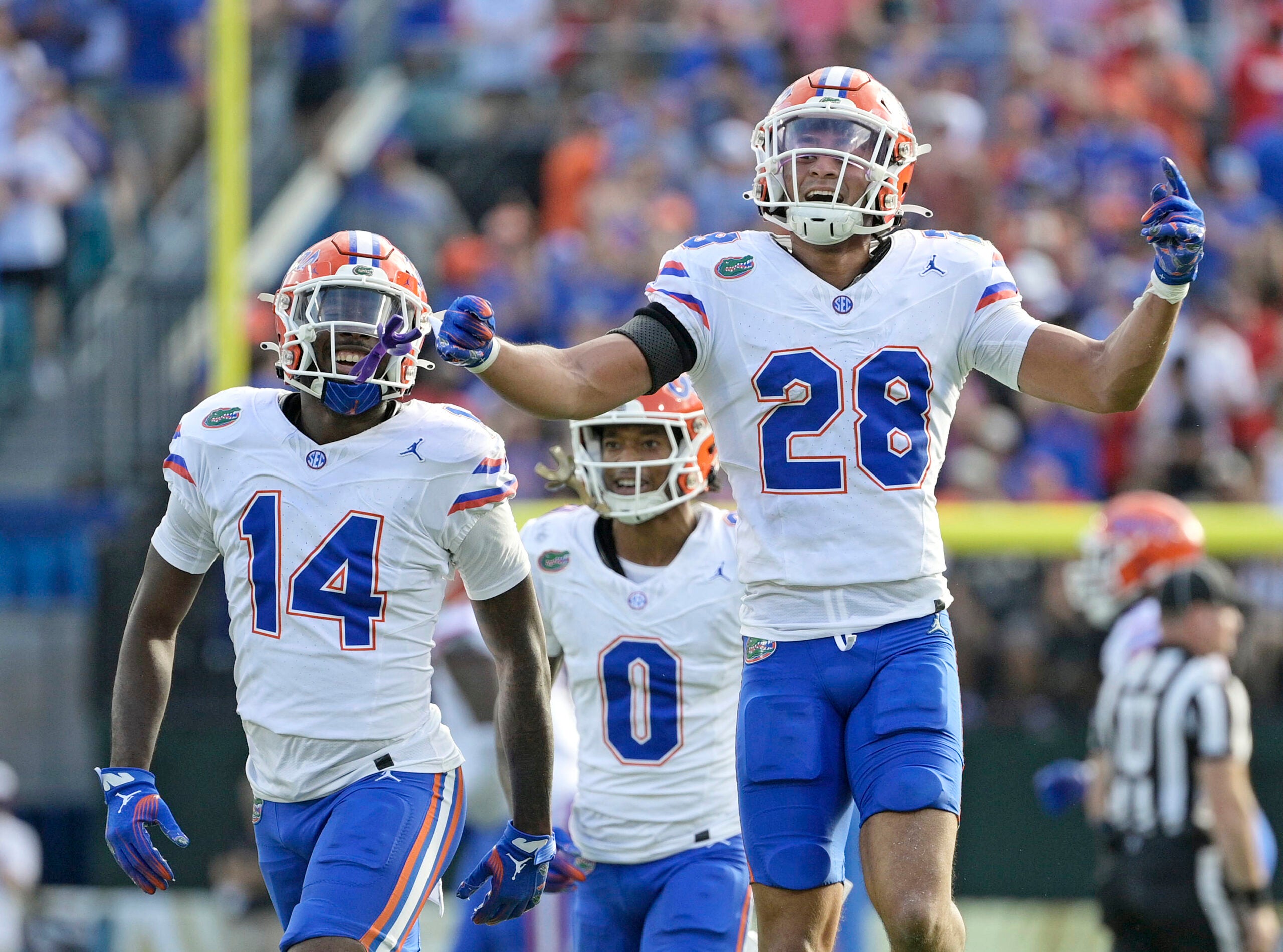 Nov 2, 2024; Jacksonville, Florida, USA; Florida Gators defensive back Devin Moore (28) celebrates after an interception against the Georgia Bulldogs during the first half at EverBank Stadium.