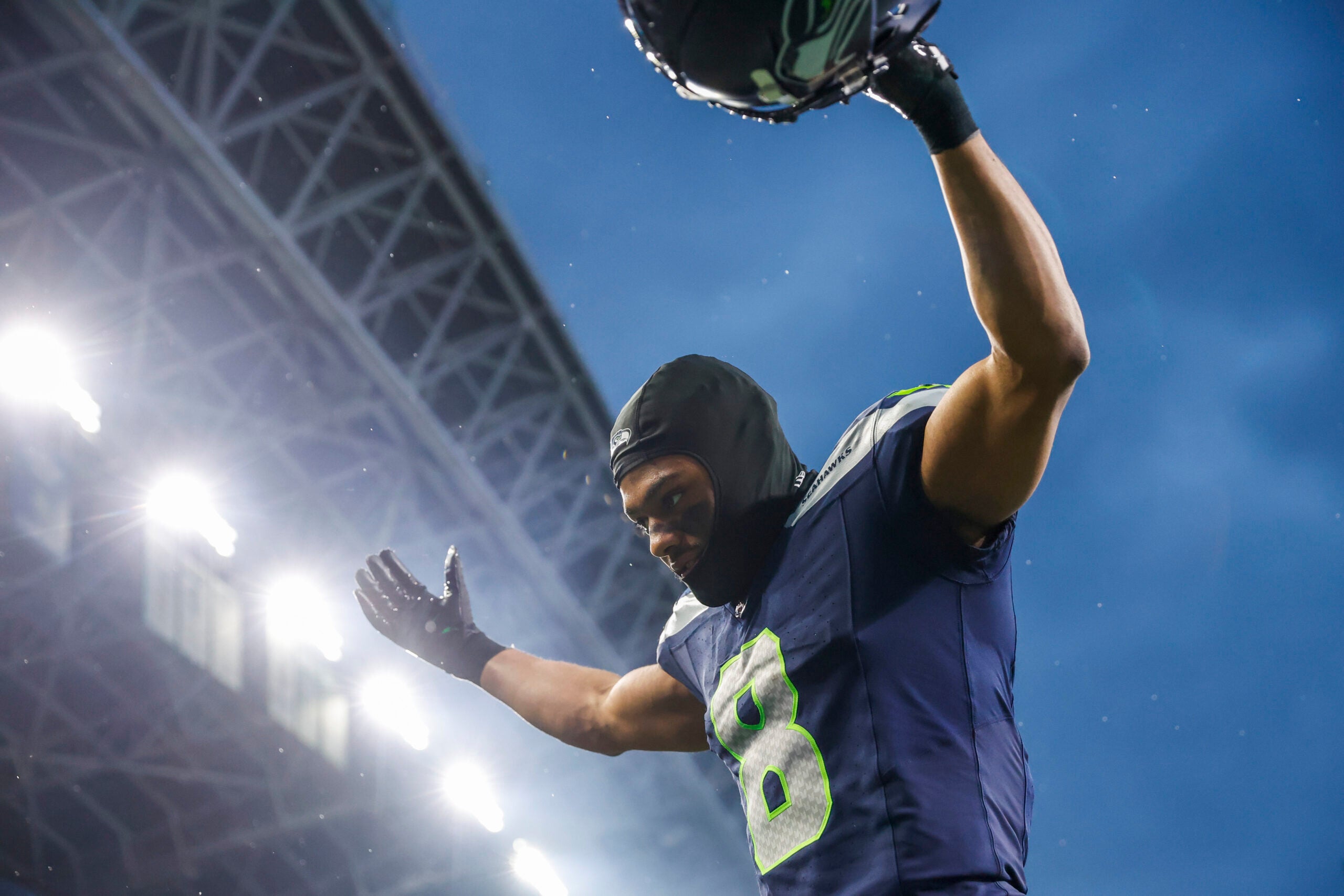 Nov 24, 2024; Seattle, Washington, USA; Seattle Seahawks cornerback Coby Bryant (8) celebrates as he walks to the locker room following a victory against the Arizona Cardinals at Lumen Field.