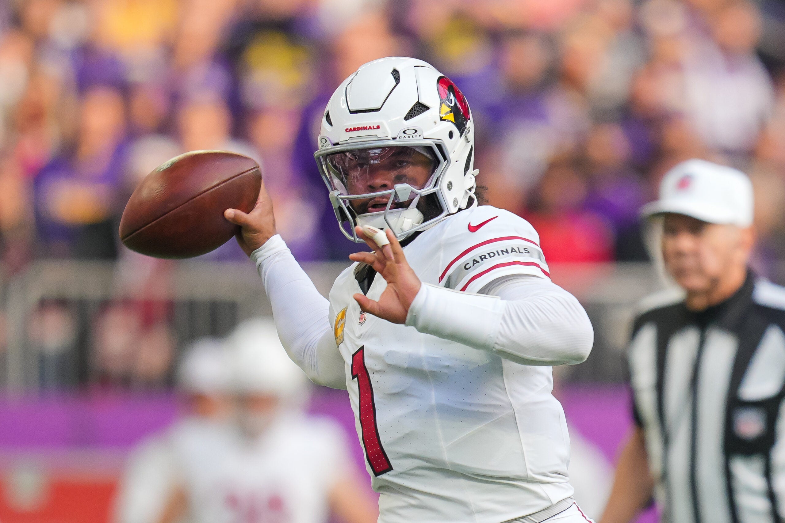 Dec 1, 2024; Minneapolis, Minnesota, USA; Arizona Cardinals quarterback Kyler Murray (1) passes against the Minnesota Vikings in the second quarter at U.S. Bank Stadium.