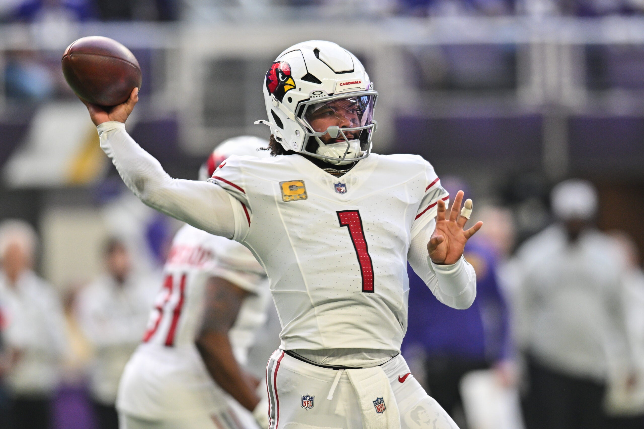 Dec 1, 2024; Minneapolis, Minnesota, USA; Arizona Cardinals quarterback Kyler Murray (1) throws a pass against the Minnesota Vikings during the second quarter at U.S. Bank Stadium.