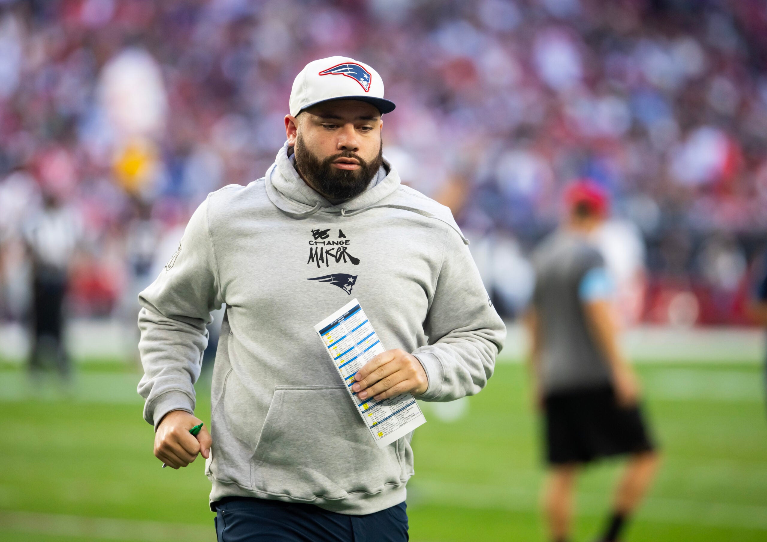 Dec 15, 2024; Glendale, Arizona, USA; New England Patriots quarterback coach T.C. McCartney against the Arizona Cardinals at State Farm Stadium. Mandatory Credit: Mark J. Rebilas-Imagn Images