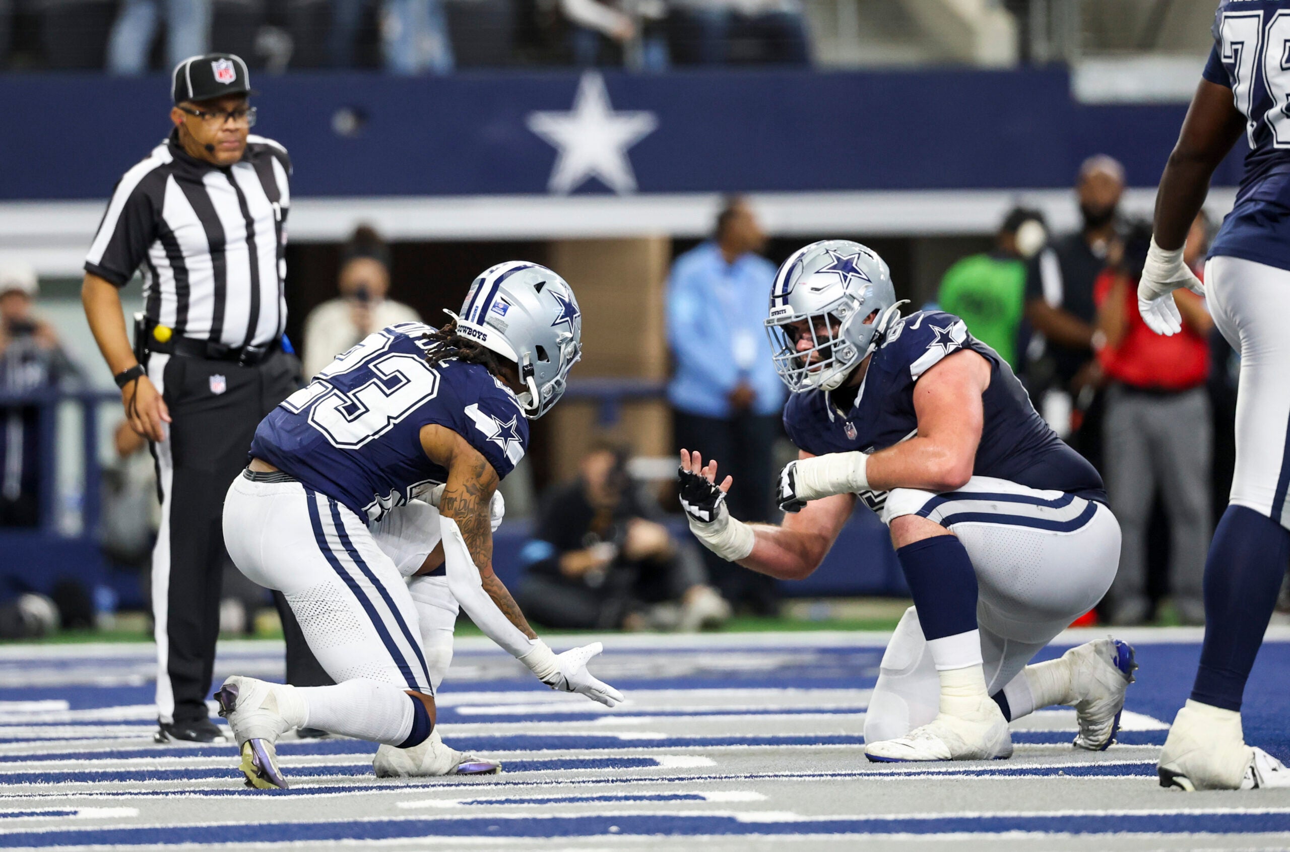 Jan 5, 2025; Arlington, Texas, USA; Dallas Cowboys running back Rico Dowdle (23) celebrates with Dallas Cowboys center Brock Hoffman (67) after scoring a touchdown during the second half against the Washington Commanders at AT&T Stadium.