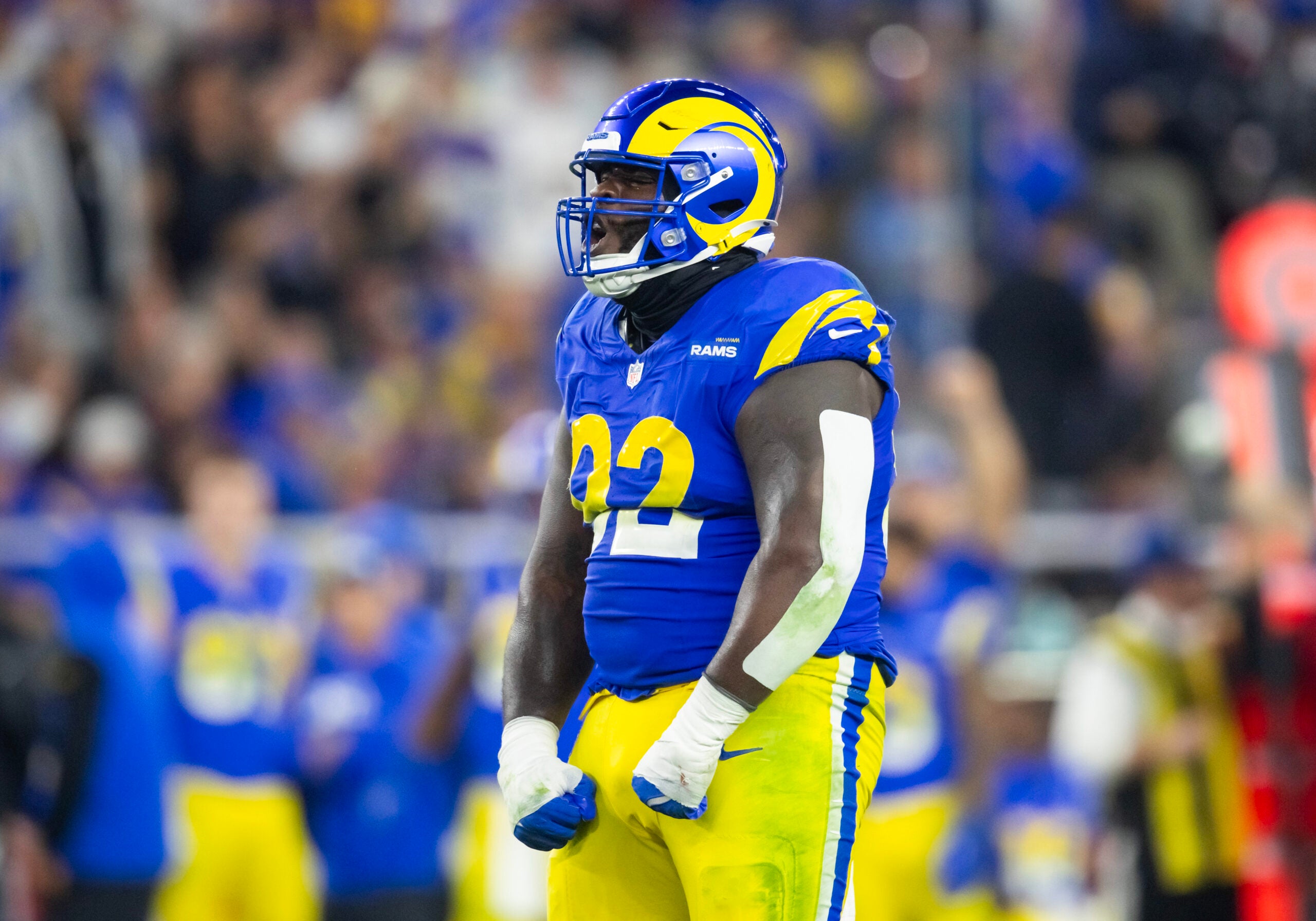 Jan 13, 2025; Glendale, AZ, USA; Los Angeles Rams defensive tackle Neville Gallimore (92) celebrates a play against the Minnesota Vikings during an NFC wild card game at State Farm Stadium.