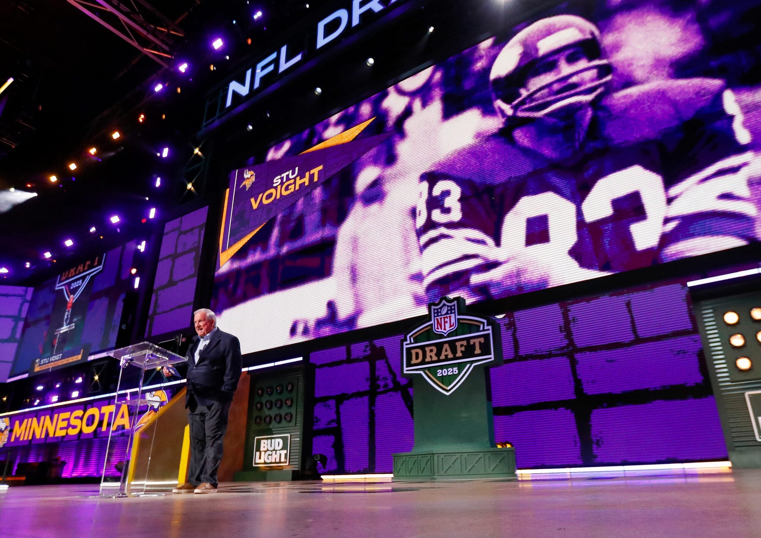 Former Minnesota Vikings tight end Stu Voigt announces the team’s selection with the 102nd overall pick during the third round of the 2025 NFL Draft on Friday, April 25, 2025, at Lambeau Field in Green Bay, Wisconsin. The draft runs through April 26.