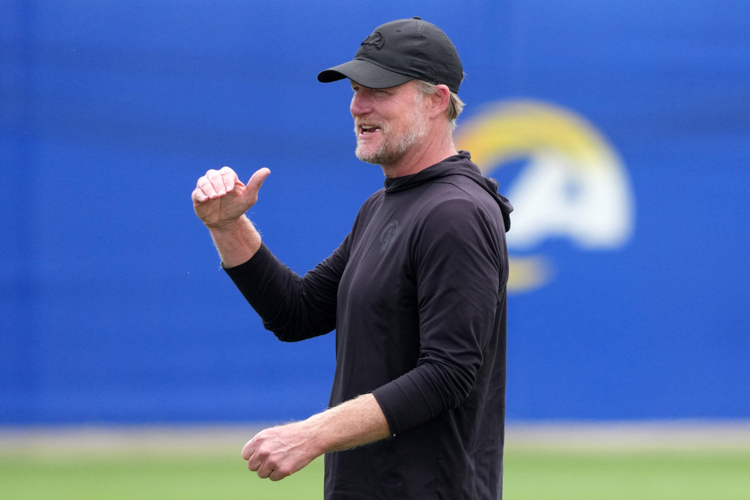 May 28, 2025; Woodland Hills, CA, USA; Los Angeles Rams general manager Les Snead reacts during organized team activities at Rams Practice Facility.