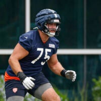 Jun 3, 2025; Lake Forest, IL, USA; Chicago Bears offensive tackle Ozzy Trapilo (75) warms up during minicamp at Halas Hall.