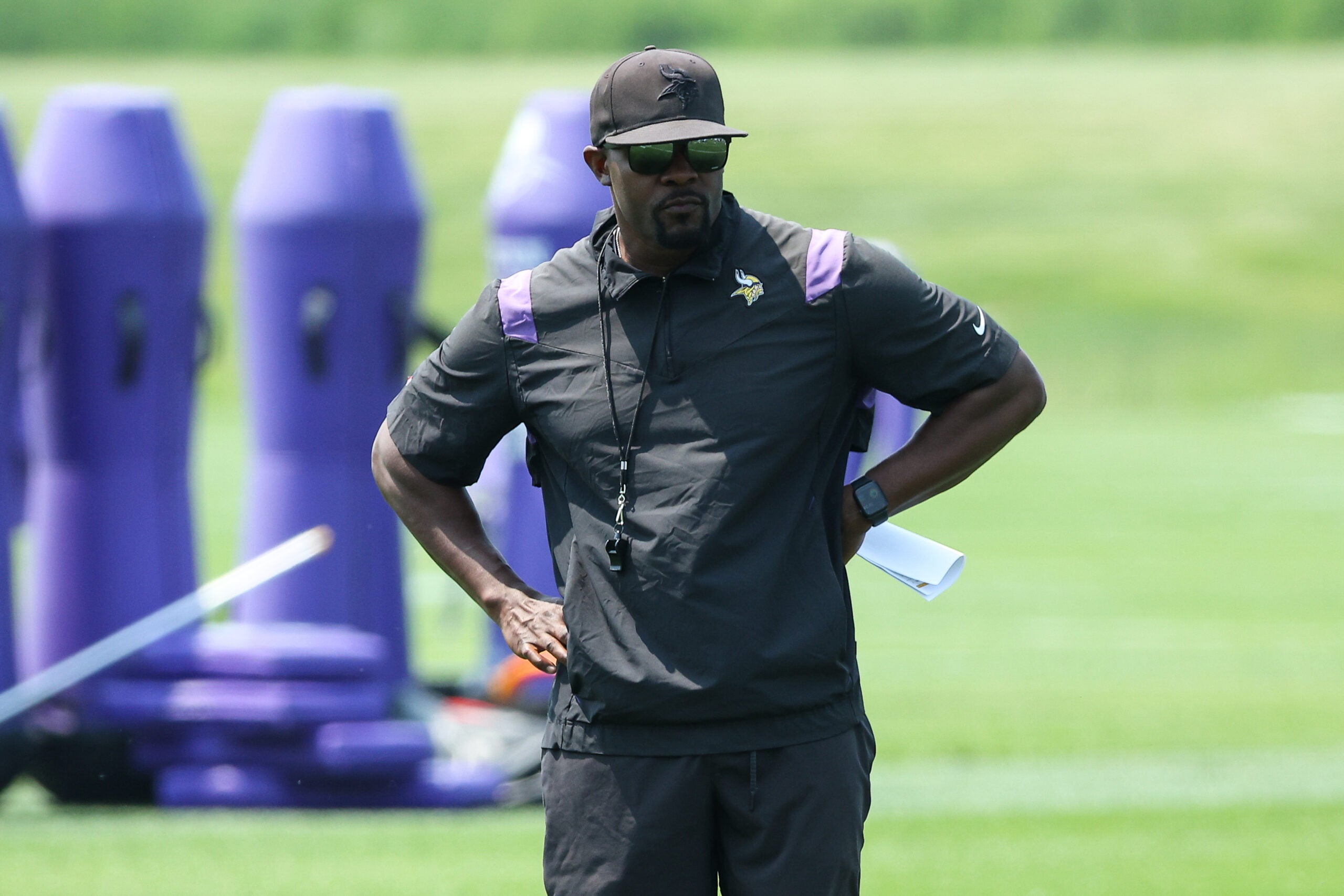 Jun 10, 2025; Minneapolis, MN, USA; Minnesota Vikings defensive coordinator Brian Flores watches practices during minicamp at the Minnesota Vikings Training Facility.