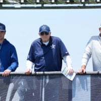 Jul 22, 2025; Oxnard, CA, USA; Dallas Cowboys owner Jerry Jones (center) watches with grandson John Stephen Jones (left) and son Stephen Jones during training camp at the River Ridge Fields.
