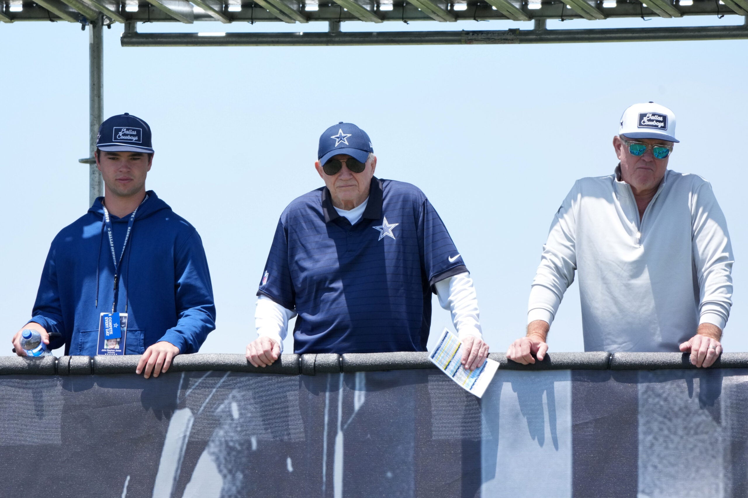 Jul 22, 2025; Oxnard, CA, USA; Dallas Cowboys owner Jerry Jones (center) watches with grandson John Stephen Jones (left) and son Stephen Jones during training camp at the River Ridge Fields.