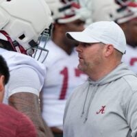 July 30, 2025; Tuscaloosa, AL, USA; Defensive coordinator Kane Wommack talks to defensive lineman London Simmons during the first practice session of the preseason for the Alabama Crimson Tide.