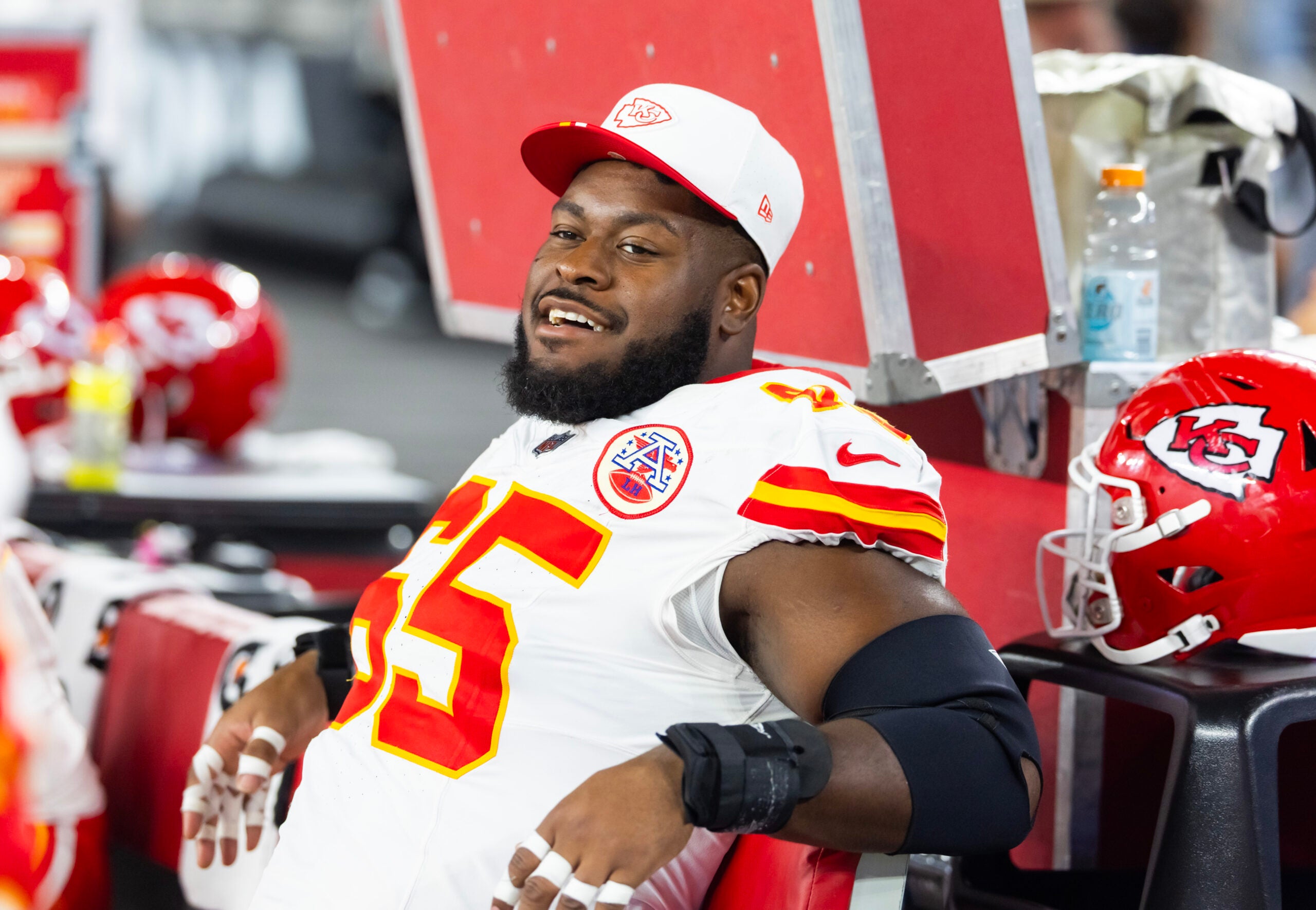 Aug 9, 2025; Glendale, Arizona, USA; Kansas City Chiefs guard Trey Smith (65) against the Arizona Cardinals during a preseason NFL game at State Farm Stadium.