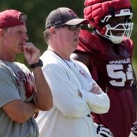 Oklahoma head football coach Brent Venables and Oklahoma offensive line coach Bill Bedenbaugh watch practice during football practice for the University of Oklahoma Sooners in Norman, Okla., Wednesday, Aug., 6, 2025.
