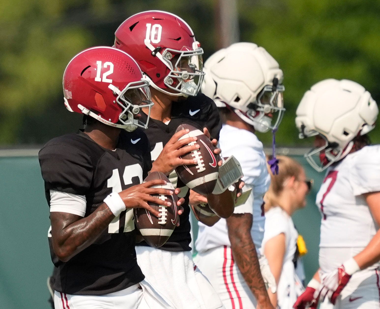 Aug. 19, 2025, Tuscaloosa, AL; Quarterbacks Keelon Russell and Austin Mack throw during practice for the Alabama Crimson Tide.