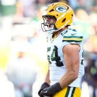 Aug 23, 2025; Green Bay, Wisconsin, USA; Green Bay Packers linebacker Kristian Welch (54) reacts to tackling Seattle Seahawks running back Anthony Tyus III (35) during the second half at Lambeau Field