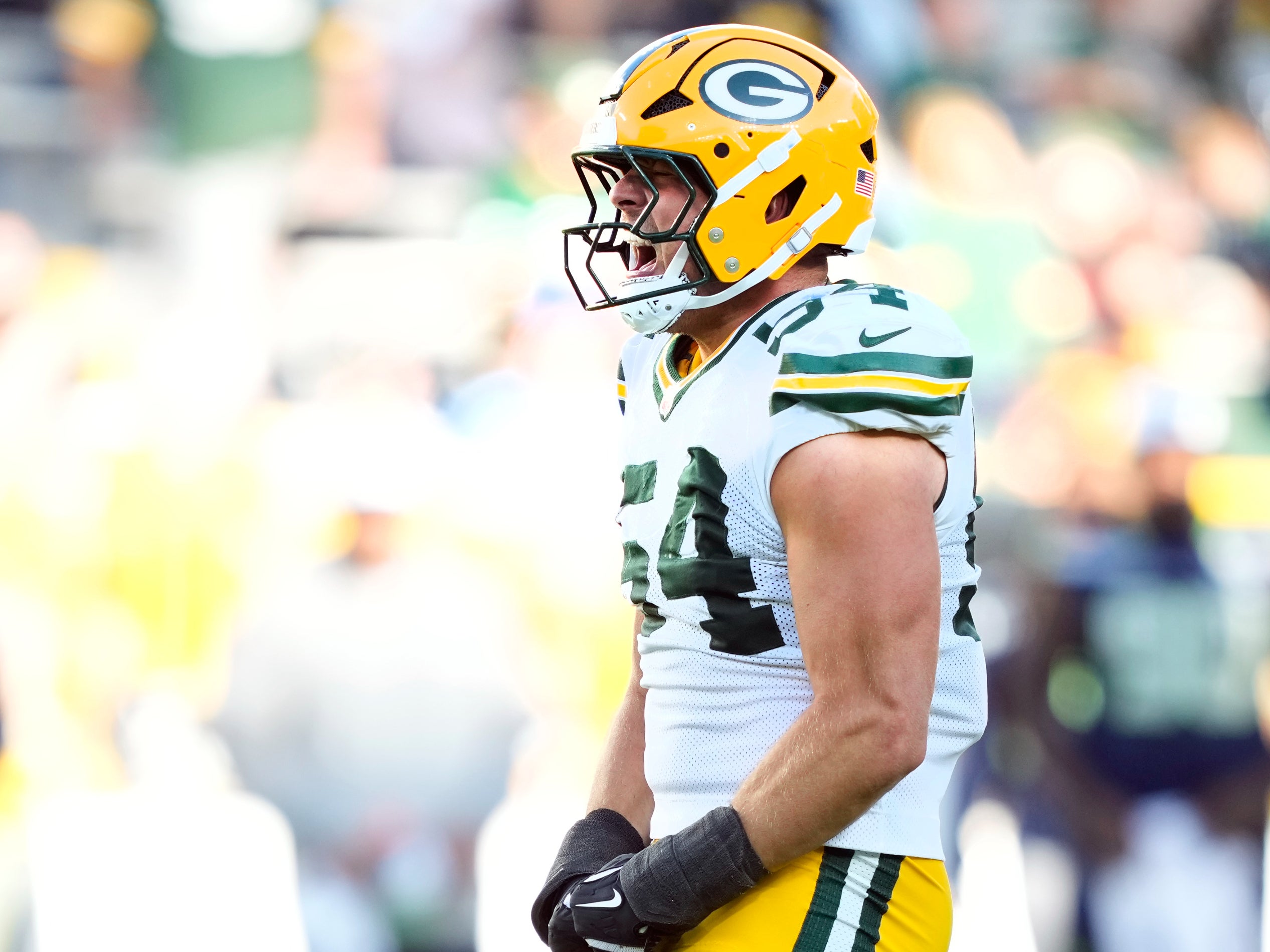 Aug 23, 2025; Green Bay, Wisconsin, USA; Green Bay Packers linebacker Kristian Welch (54) reacts to tackling Seattle Seahawks running back Anthony Tyus III (35) during the second half at Lambeau Field