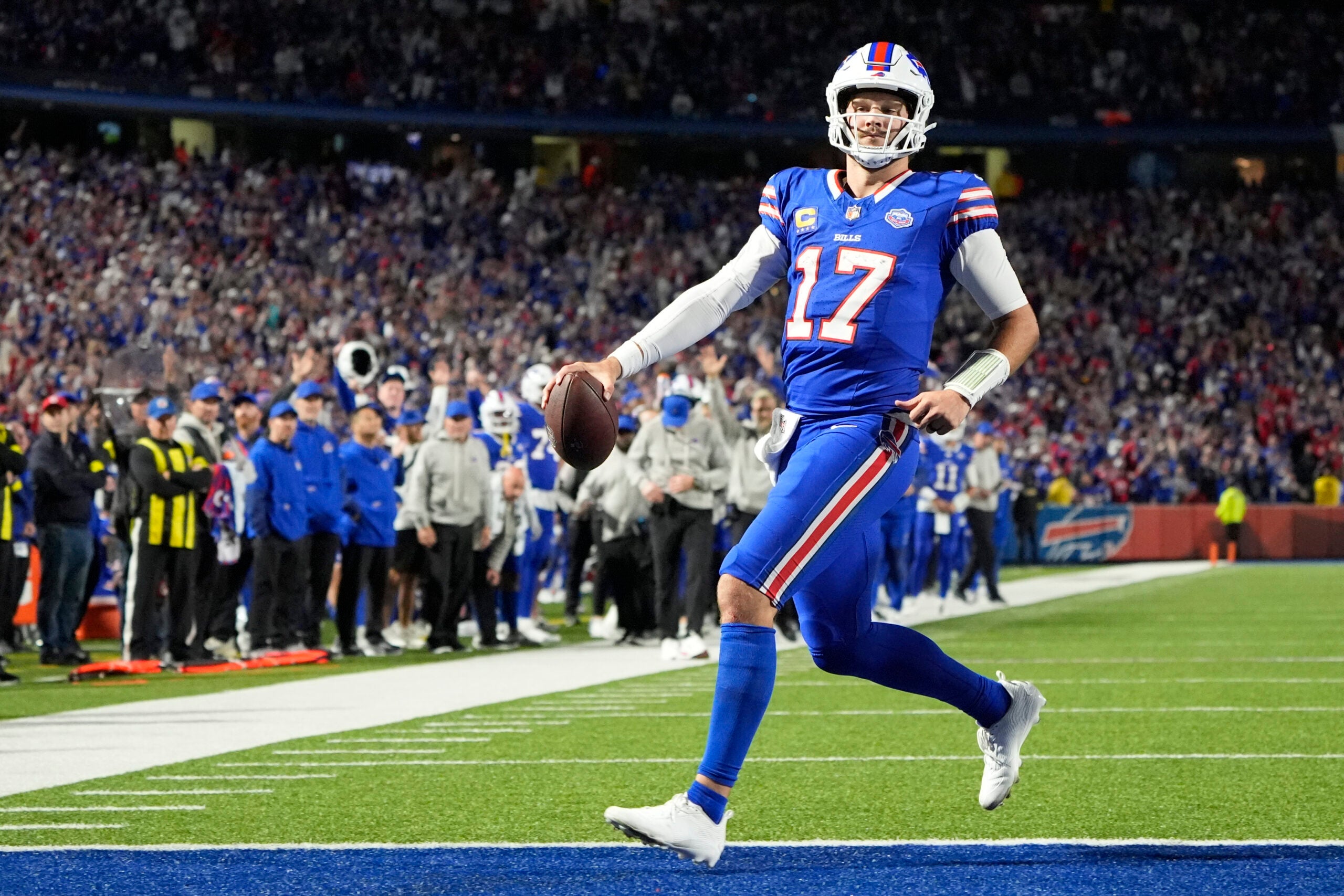 Sep 7, 2025; Orchard Park, New York, USA; Buffalo Bills quarterback Josh Allen (17) -rtb for a touchdown during the fourth quarter against the Baltimore Ravens at Highmark Stadium.