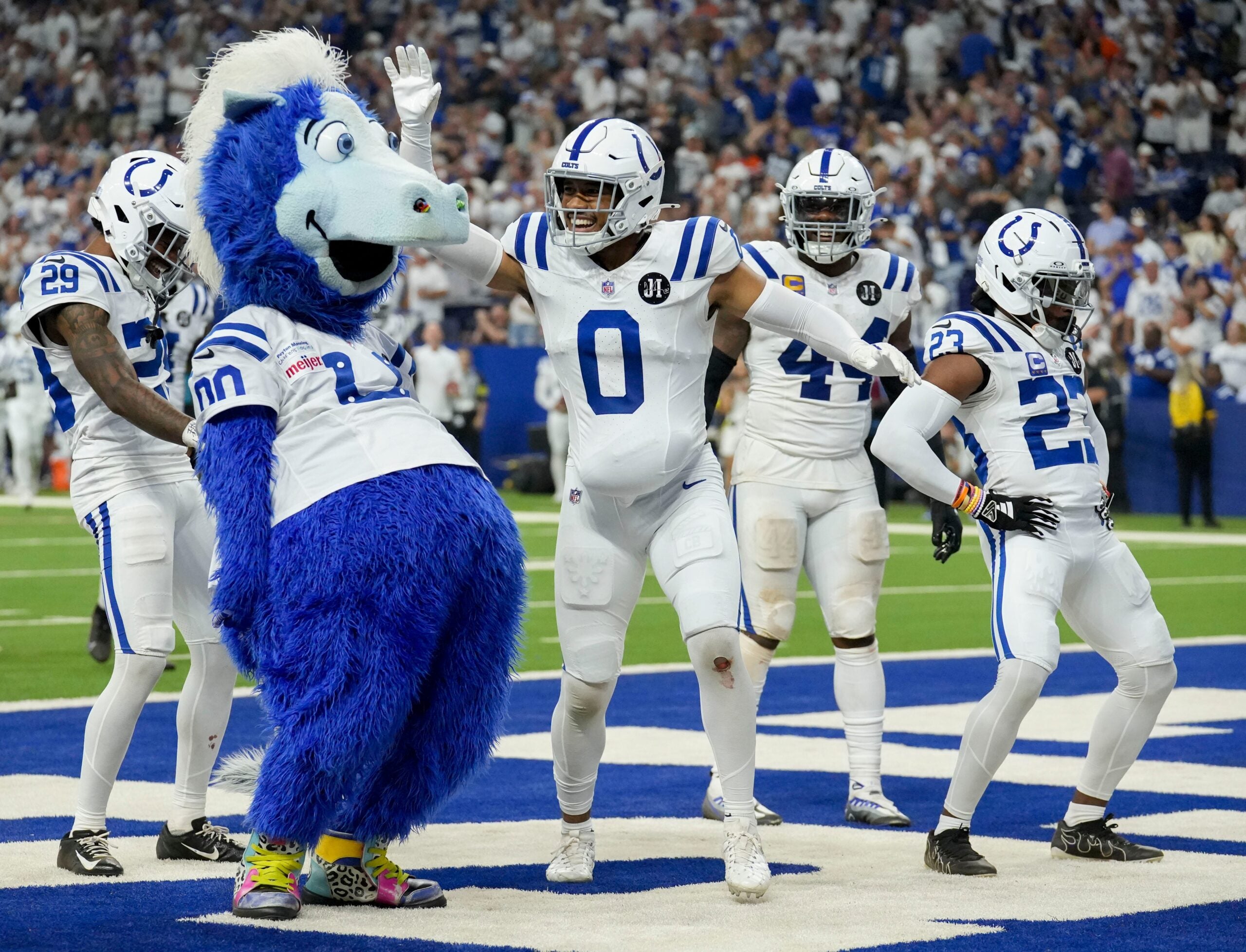 Colts defense celebrates a turnover with mascot Blue