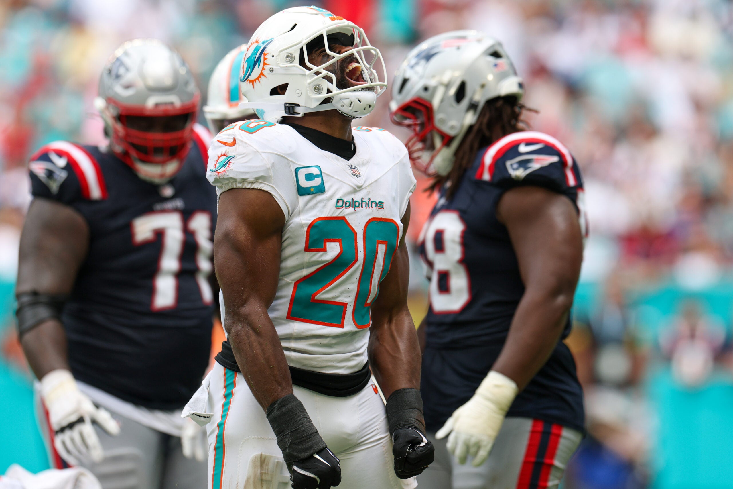 Sep 14, 2025; Miami Gardens, Florida, USA; Miami Dolphins linebacker Jordyn Brooks (20) reacts after play against the New England Patriots in the fourth quarter at Hard Rock Stadium.
