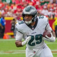 Sep 14, 2025; Kansas City, Missouri, USA; Philadelphia Eagles running back AJ Dillon (29) runs the ball against the Kansas City Chiefs during the game at GEHA Field at Arrowhead Stadium.