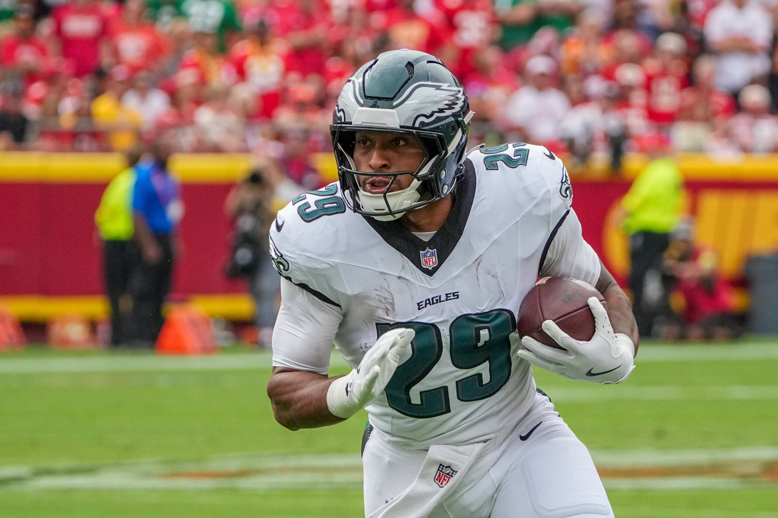 Sep 14, 2025; Kansas City, Missouri, USA; Philadelphia Eagles running back AJ Dillon (29) runs the ball against the Kansas City Chiefs during the game at GEHA Field at Arrowhead Stadium.