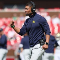 Sep 27, 2025; Fayetteville, Arkansas, USA; Notre Dame Fighting Irish head coach Marcus Freeman celebrates after a score during the third quarter against the Arkansas Razorbacks at Donald W. Reynolds Razorback Stadium. Notre Dame won 56-13. Mandatory Credit: Nelson Chenault-Imagn Images