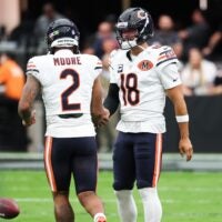 Sep 28, 2025; Paradise, Nevada, USA; Chicago Bears quarterback Caleb Williams (18) shakes hands with wide receiver DJ Moore (2) during warm ups prior to the game against the Las Vegas Raiders at Allegiant Stadium.