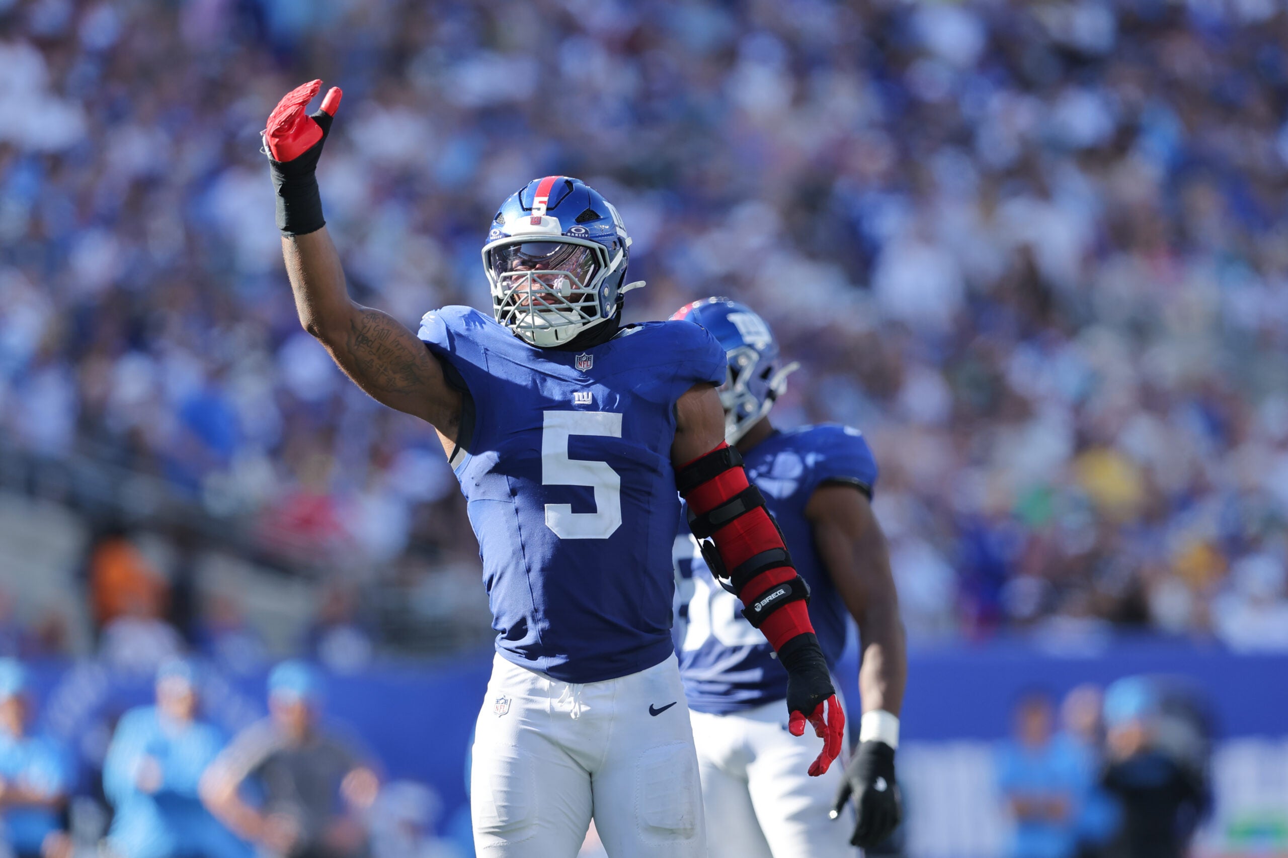 Sep 28, 2025; East Rutherford, New Jersey, USA; New York Giants linebacker Kayvon Thibodeaux (5)reacts during the fourth quarter against the Los Angeles Chargers at MetLife Stadium.