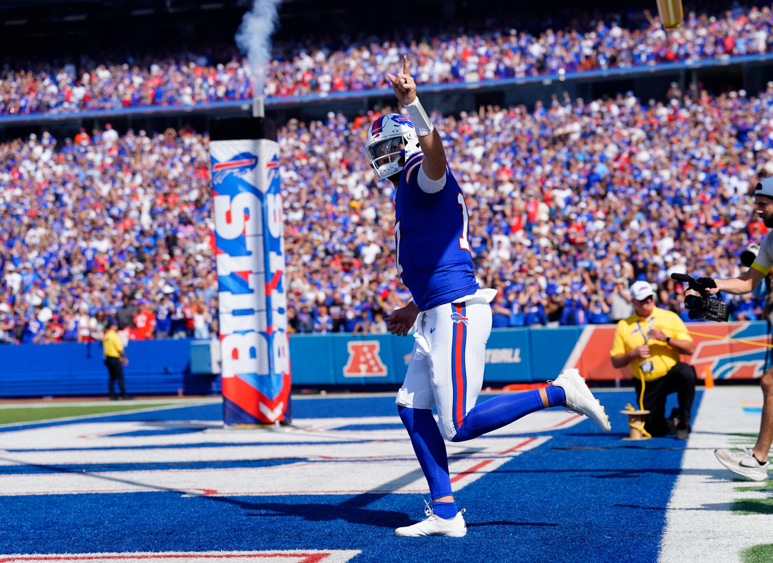 Sep 28, 2025; Orchard Park, New York, USA; Buffalo Bills quarterback Josh Allen (17) runs out prior to a game against the New Orleans Saints at Highmark Stadium.