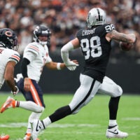 Sep 28, 2025; Paradise, Nevada, USA; Las Vegas Raiders defensive end Maxx Crosby (98) runs with the ball during the first quarter against the Chicago Bears at Allegiant Stadium.