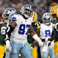 Sep 28, 2025; Arlington, Texas, USA; Dallas Cowboys defensive tackle Osa Odighizuwa (97) reacts after defending against the Green Bay Packers in the first quarter at AT&T Stadium.