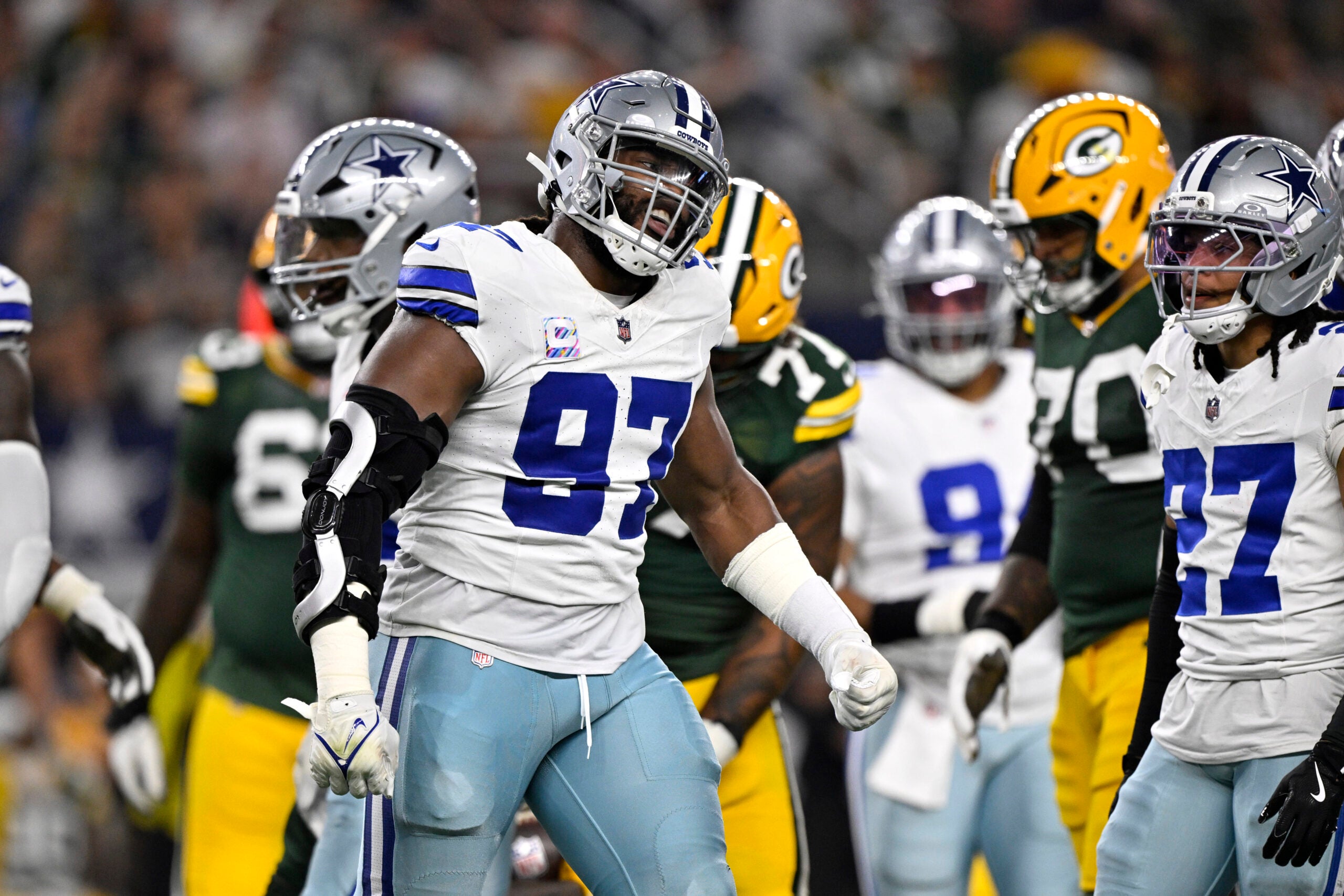 Sep 28, 2025; Arlington, Texas, USA; Dallas Cowboys defensive tackle Osa Odighizuwa (97) reacts after defending against the Green Bay Packers in the first quarter at AT&T Stadium.