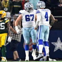 Sep 28, 2025; Arlington, Texas, USA; Dallas Cowboys quarterback Dak Prescott (4) celebrates with center Brock Hoffman (67) after a touchdown in the second quarter against the Green Bay Packers at AT&T Stadium.