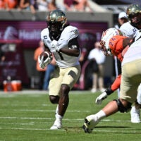 Oct 4, 2025; Blacksburg, Virginia, USA; Wake Forest Demon Deacons running back Demond Claiborne (1) runs the ball during the first quarter against the Virginia Tech Hokies at Lane Stadium. Mandatory Credit: Brian Bishop-Imagn Images