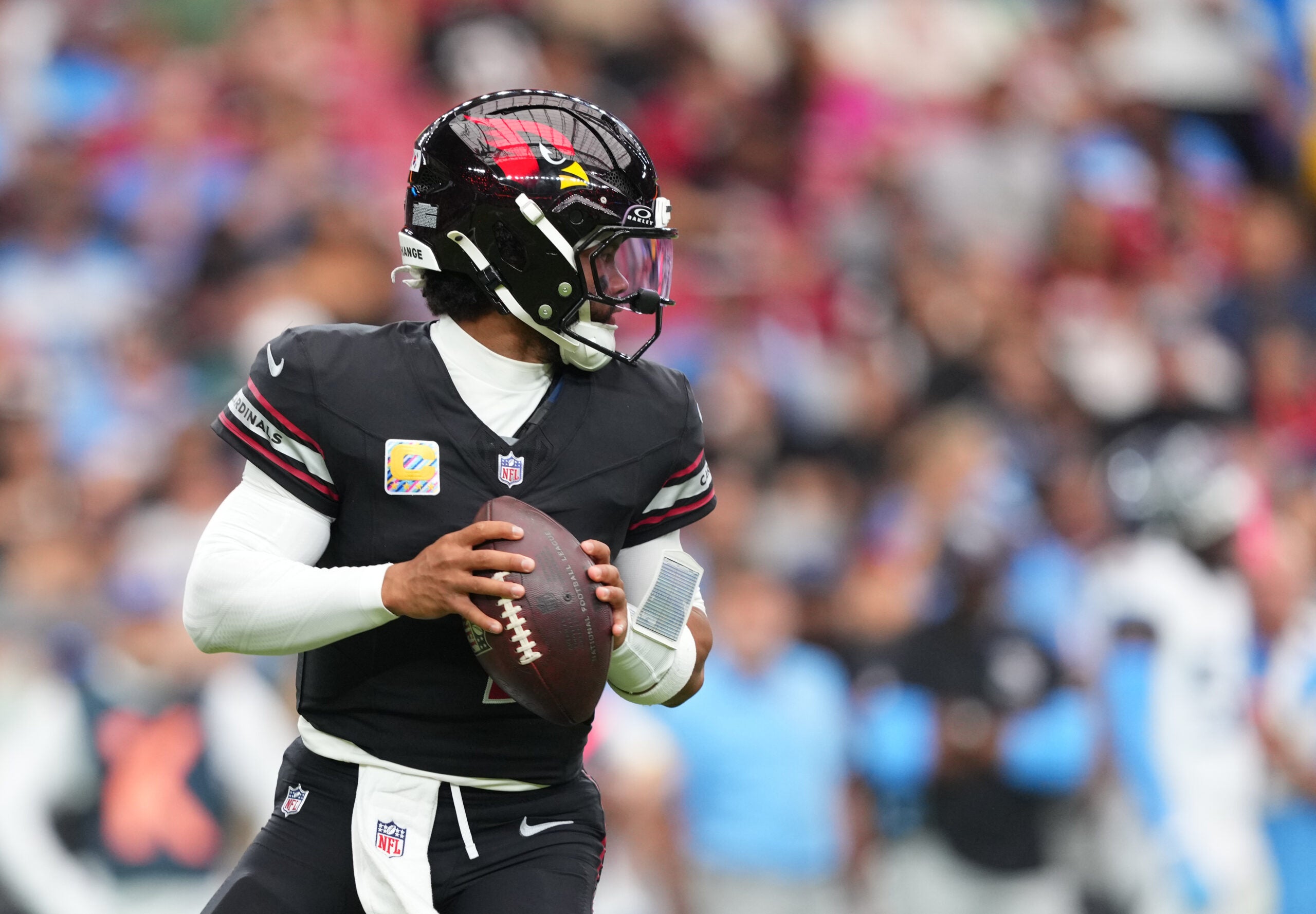 Oct 5, 2025; Glendale, Arizona, USA; Arizona Cardinals quarterback Kyler Murray (1) looks to throw against the Tennessee Titans during the second quarter at State Farm Stadium.