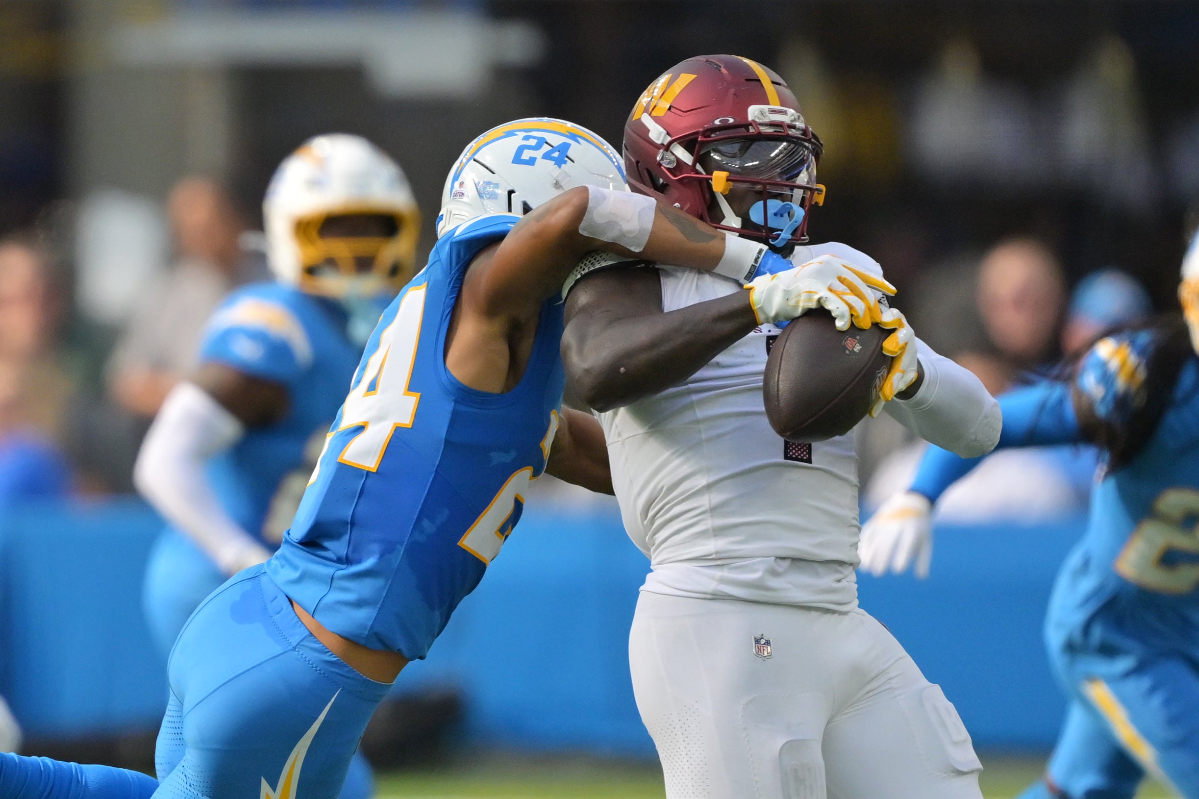 Oct 5, 2025; Inglewood, California, USA; Washington Commanders wide receiver Deebo Samuel Sr. (1) makes a catch against Los Angeles Chargers cornerback Benjamin St-Juste (24) in the second half at SoFi Stadium.