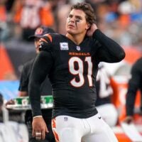 Cincinnati Bengals defensive end Trey Hendrickson (91) watches a replay as the Detroit Lions celebrate a touchdown in the fourth quarter of the NFL Week 5 game between the Cincinnati Bengals and the Detroit Lions at Paycor Stadium in downtown Cincinnati on Sunday, Oct. 5, 2025. The Bengals continued a losing streak, falling 37-24 to the Lions.