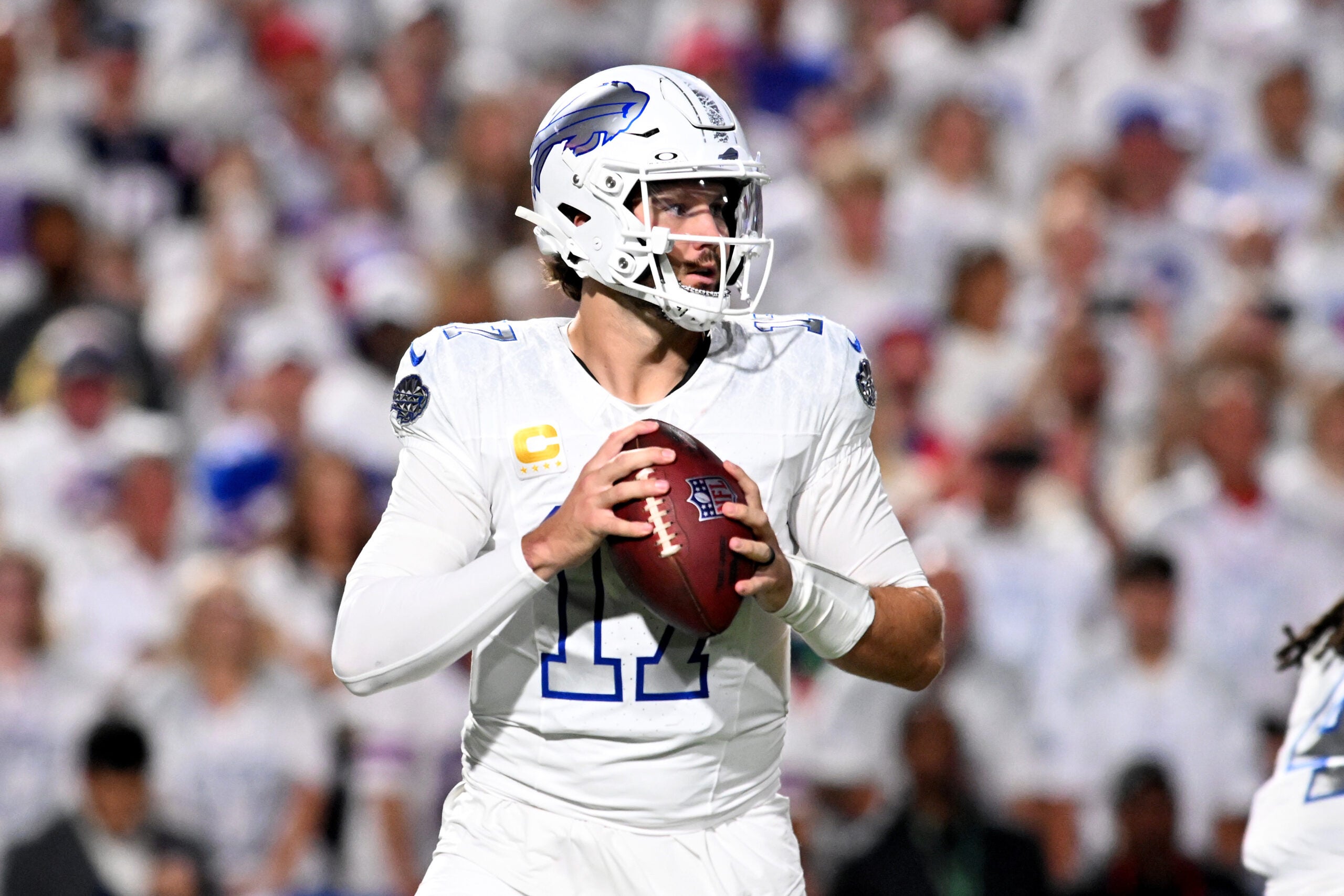 Oct 5, 2025; Orchard Park, New York, USA; Buffalo Bills quarterback Josh Allen (17) drops back to pass against the New England Patriots during the first half at Highmark Stadium.